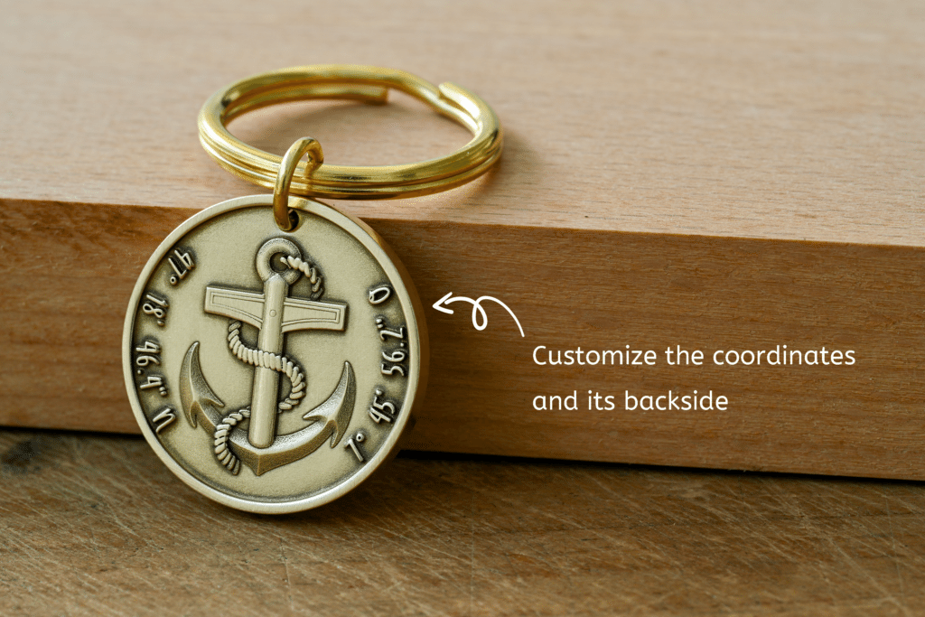 Brass anchor keychain tag with customizable coordinates engraved around the edge