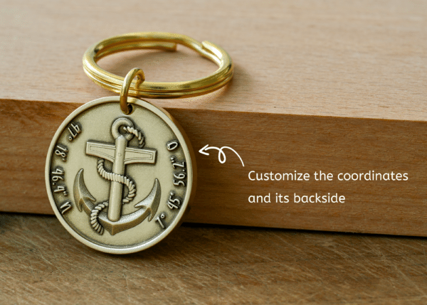 Brass anchor keychain tag with customizable coordinates engraved around the edge