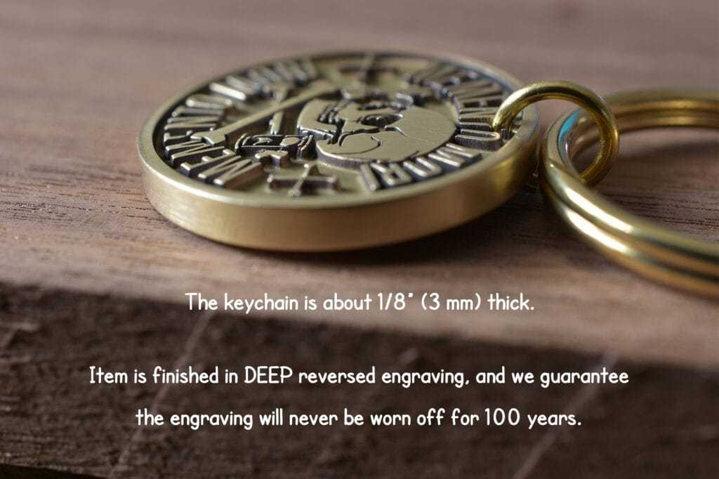 Close-up of a durable gold keychain with deep engraving, guaranteed to last 100 years.