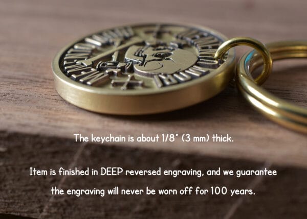 Close-up of a durable gold keychain with deep engraving, guaranteed to last 100 years.