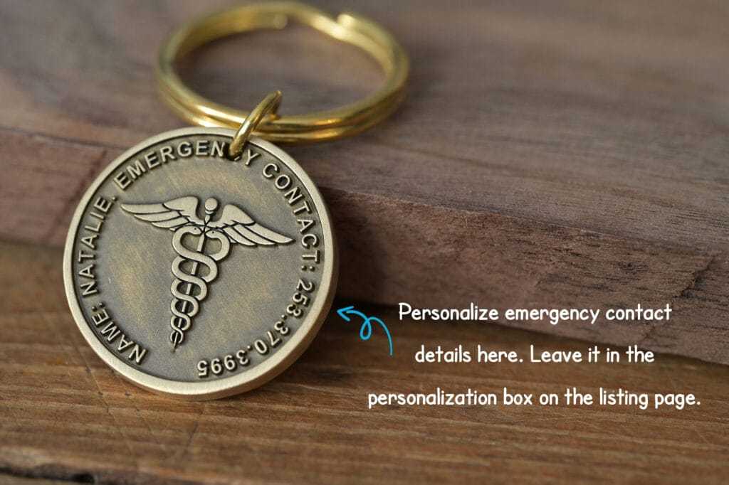 Personalized emergency contact keychain with medical symbol on wood, customizable details for safety and peace of mind.