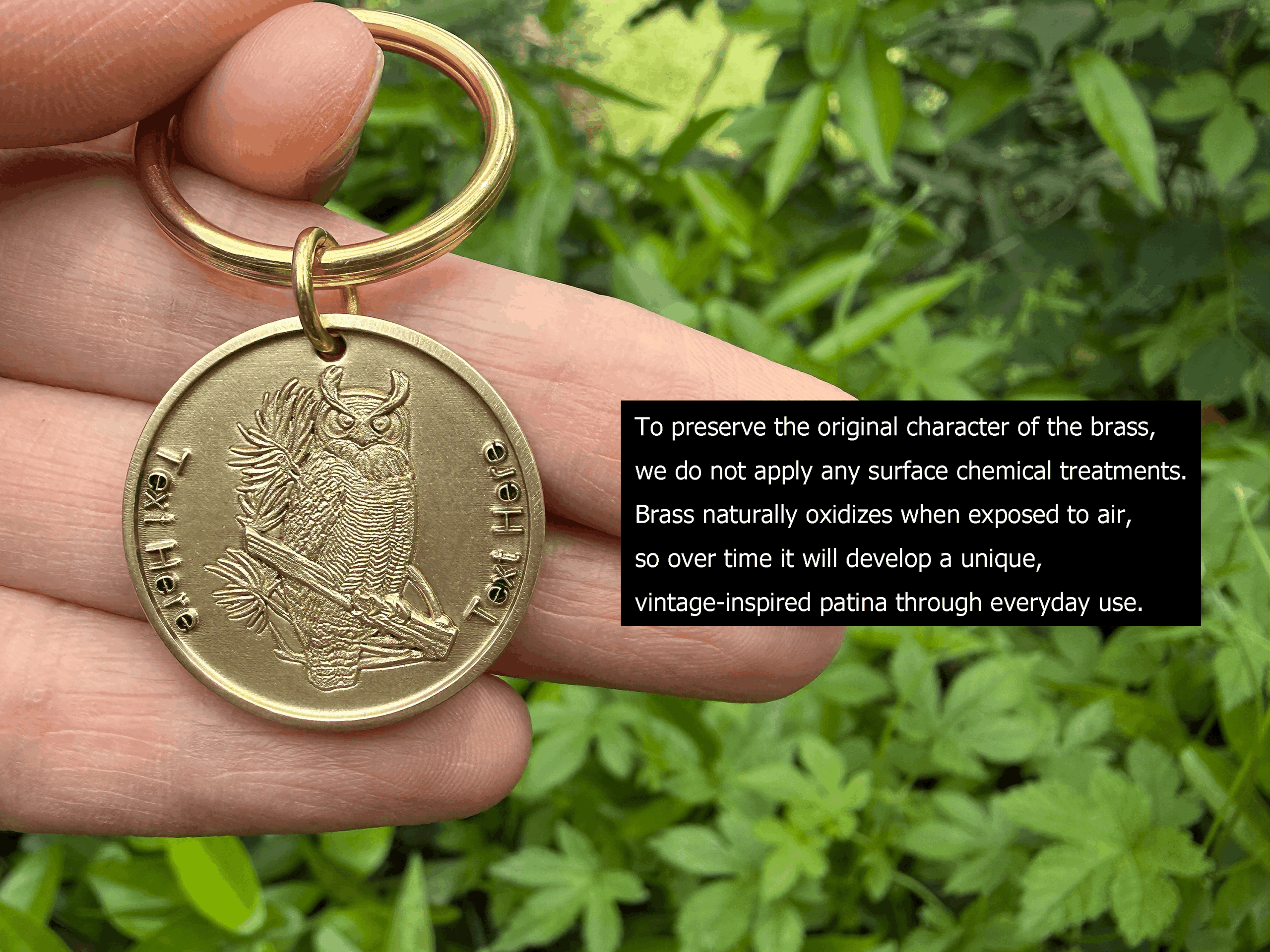 Brass keychain with owl engraving held in hand, text area for personalization. Natural patina over time.