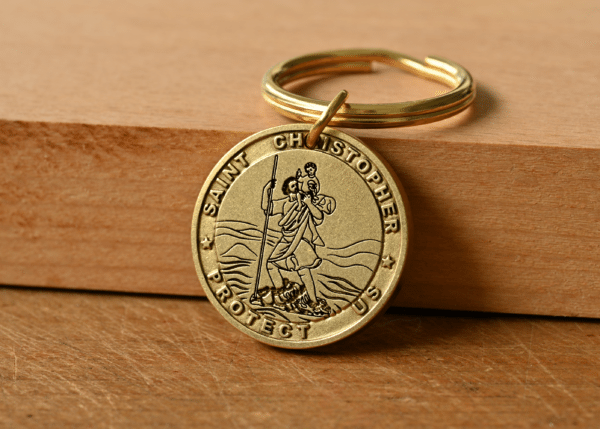 Gold Saint Christopher medallion keychain engraved with Saint Christopher Protect Us