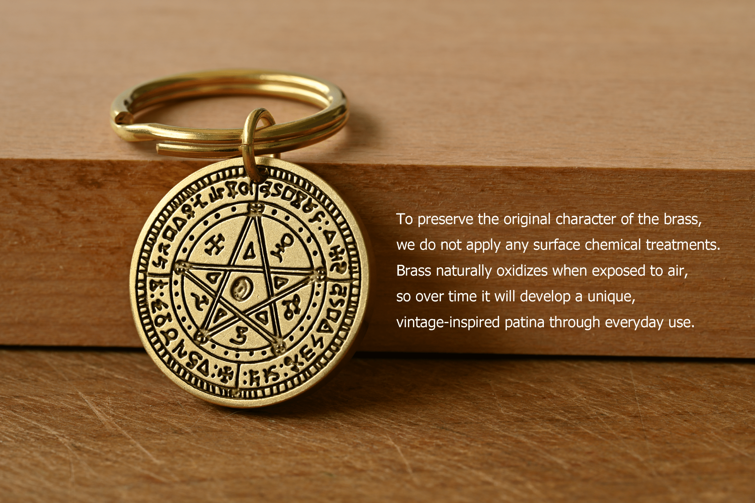 Brass pentagram medallion keychain with text: To preserve the original character of the brass, we do not apply any surface chemical treatments. Brass naturally oxidizes when exposed to air, so over time it will develop a unique, vintage-inspired patina through everyday use