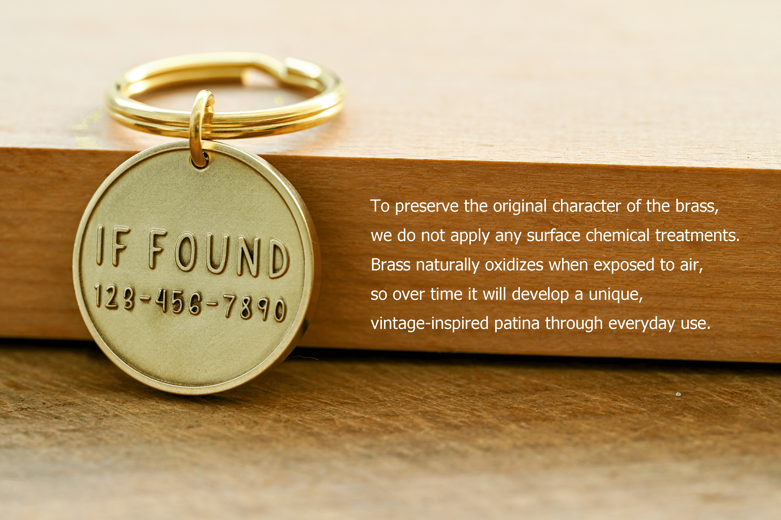 Brass tag stamped IF FOUND 123-456-7890. Text: To preserve the original character of the brass, we do not apply any surface chemical treatments. Brass naturally oxidizes when exposed to air, so over time it will develop a unique, vintage-inspired patina through everyday use